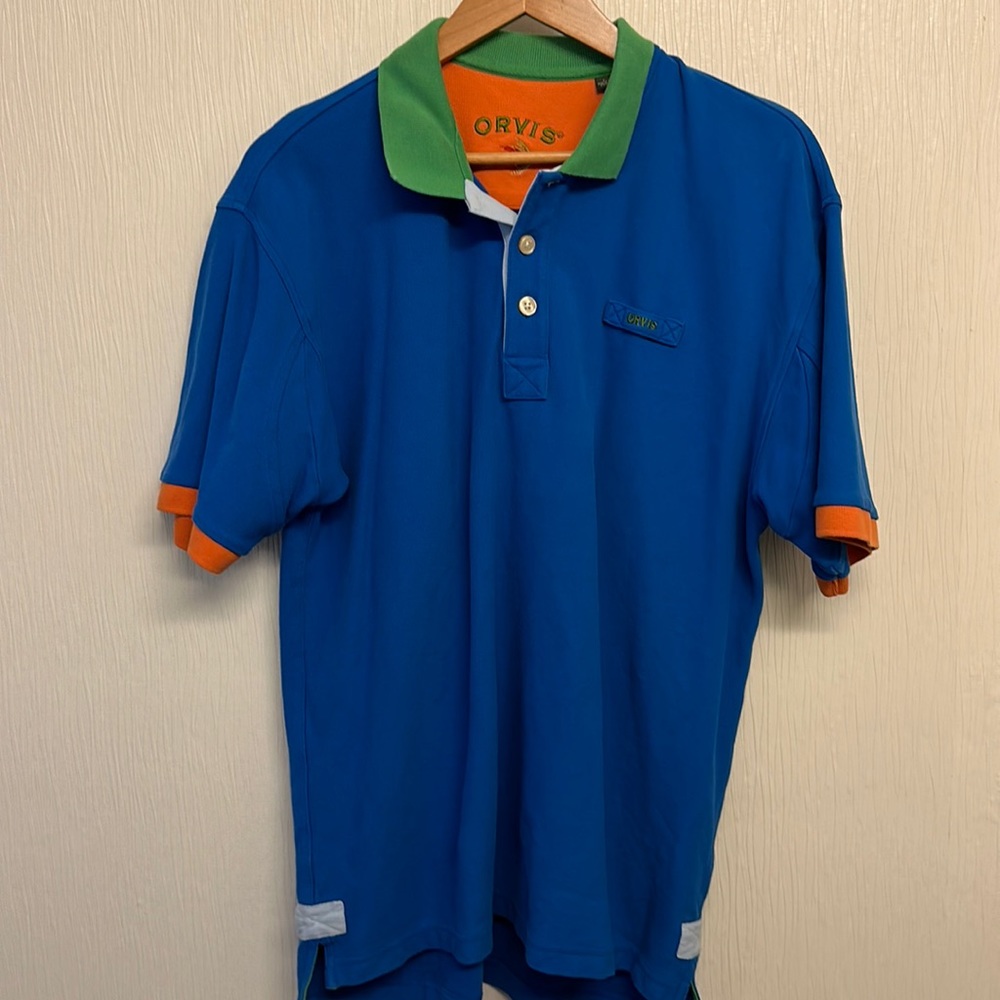 Used Orvis Men’s S/S blue shirt with orange and green trim.